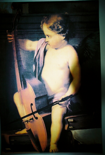 cupid playing the cello at a church in Hawaii